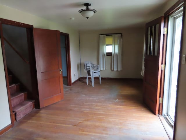 529 1st St N, Truman, MN 56088 - unfurnished room with plenty of natural light, light wood finished floors, and stairs