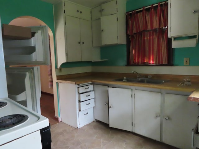 529 1st St N, Truman, MN 56088 - kitchen featuring a sink and white range with electric cooktop