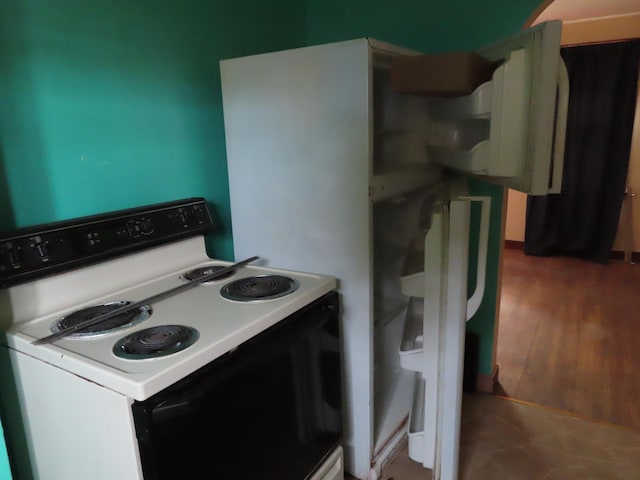 529 1st St N, Truman, MN 56088 - kitchen featuring range with electric cooktop