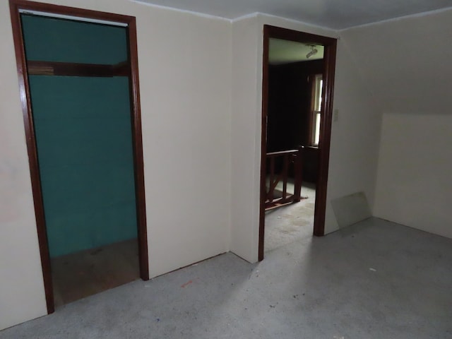 529 1st St N, Truman, MN 56088 - unfurnished bedroom featuring lofted ceiling