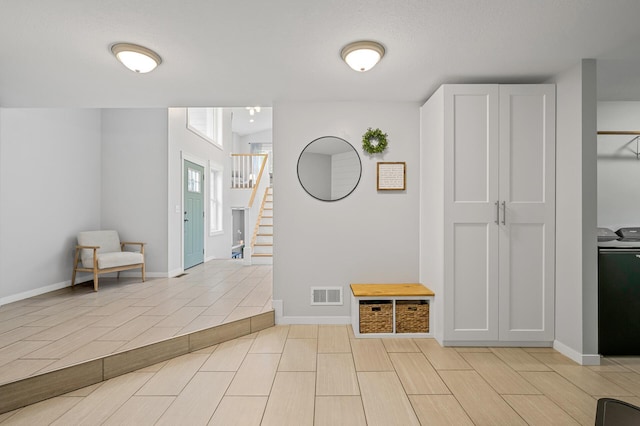 975 100th St NE, Monticello Twp, MN 55362 - hallway featuring stairway and baseboards