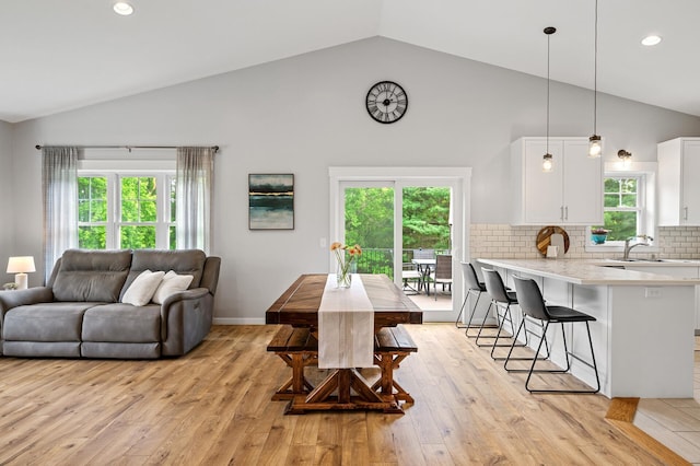 975 100th St NE, Monticello Twp, MN 55362 - dining room with light wood-style floors, recessed lighting, high vaulted ceiling, and baseboards