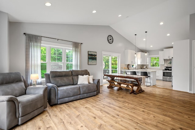 975 100th St NE, Monticello Twp, MN 55362 - living room featuring high vaulted ceiling, light wood-style flooring, and recessed lighting