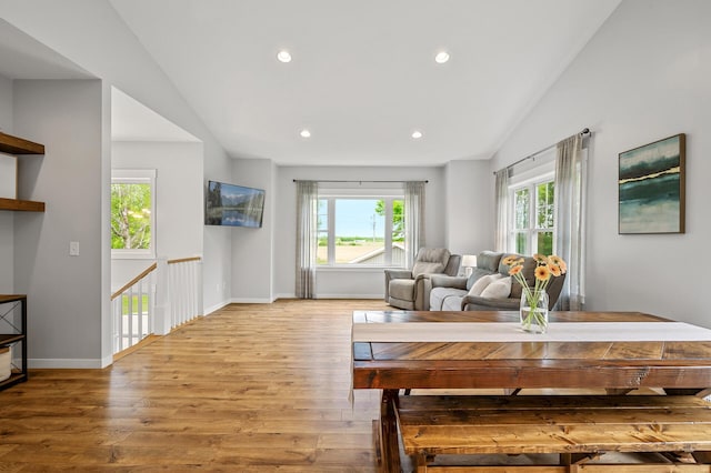 975 100th St NE, Monticello Twp, MN 55362 - living area featuring vaulted ceiling, wood finished floors, recessed lighting, and baseboards