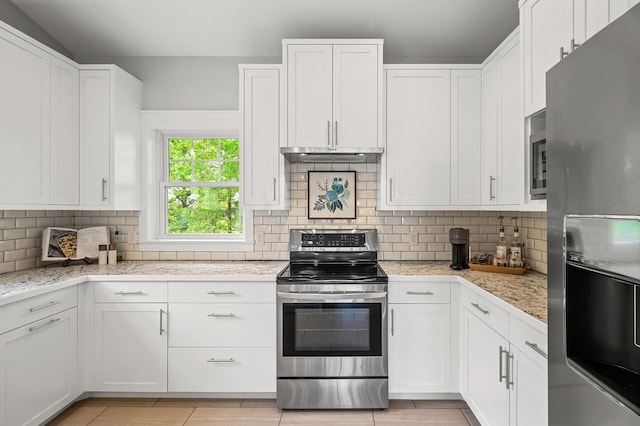 975 100th St NE, Monticello Twp, MN 55362 - kitchen with appliances with stainless steel finishes, white cabinets, and backsplash