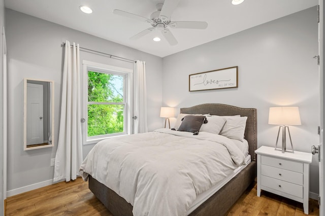 975 100th St NE, Monticello Twp, MN 55362 - bedroom with wood finished floors, recessed lighting, baseboards, and a ceiling fan