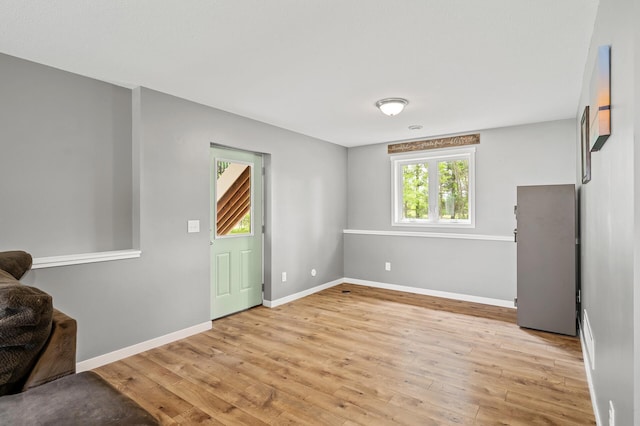 975 100th St NE, Monticello Twp, MN 55362 - empty room featuring light wood-style floors and baseboards