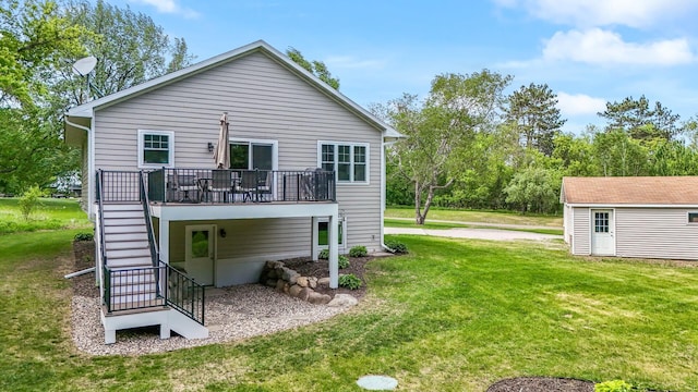 975 100th St NE, Monticello Twp, MN 55362 - rear view of house with stairs, a lawn, a deck, and an outdoor structure