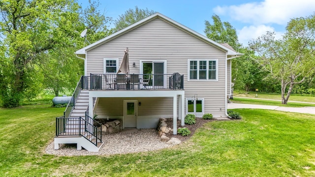 975 100th St NE, Monticello Twp, MN 55362 - rear view of property featuring stairway, a wooden deck, and a lawn