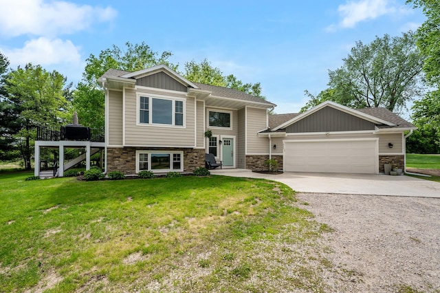 975 100th St NE, Monticello Twp, MN 55362 - bi-level home with concrete driveway, a garage, stone siding, and a front lawn