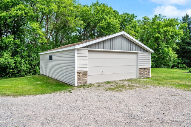 975 100th St NE, Monticello Twp, MN 55362 - detached garage featuring view of wooded area