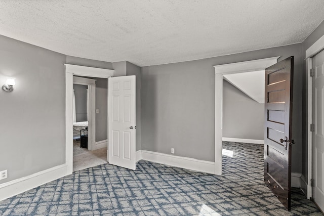 2745 Columbus Ave, Minneapolis, MN 55407 - carpeted spare room with a textured ceiling and baseboards