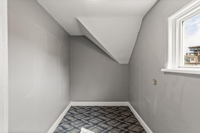 2745 Columbus Ave, Minneapolis, MN 55407 - bonus room with baseboards, dark colored carpet, and vaulted ceiling