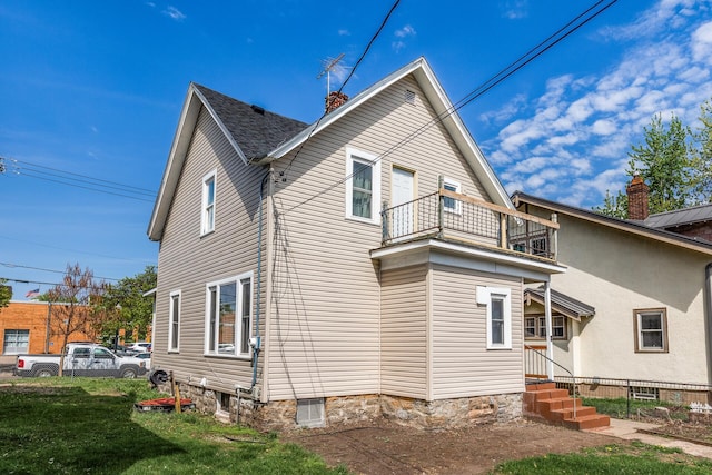 2745 Columbus Ave, Minneapolis, MN 55407 - back of property featuring a balcony and entry steps