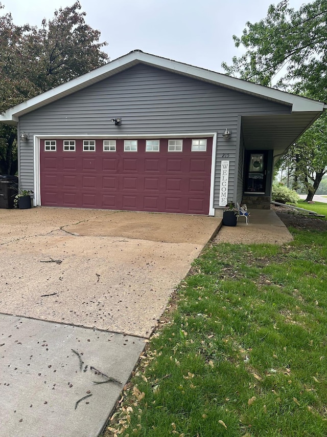 215 1st St NE, Clarks Grove, MN 56016 - view of front of home with a garage