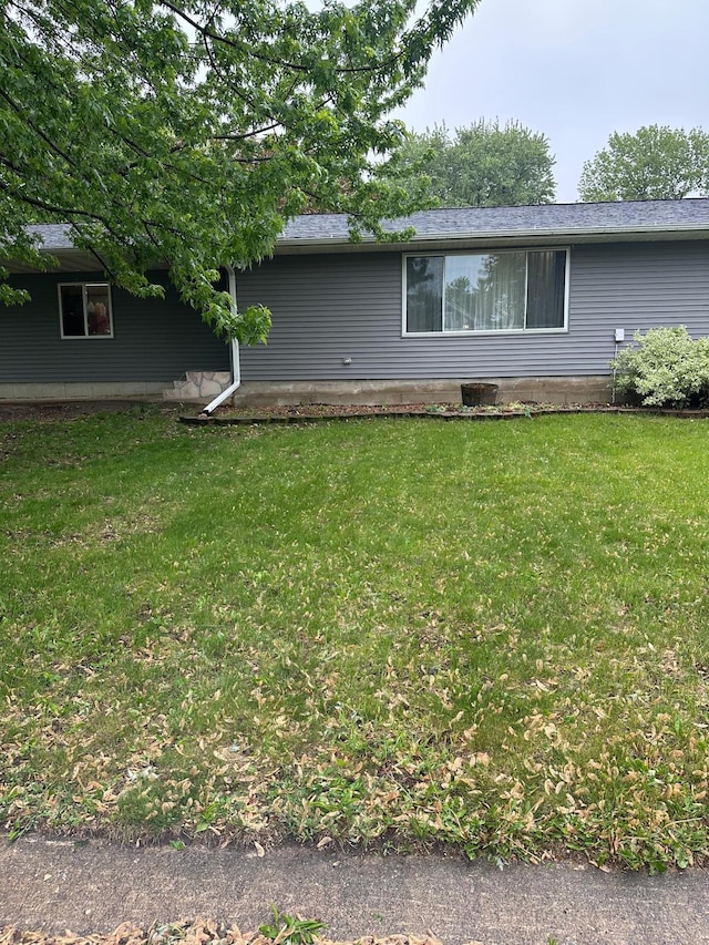 215 1st St NE, Clarks Grove, MN 56016 - view of home's exterior with a lawn