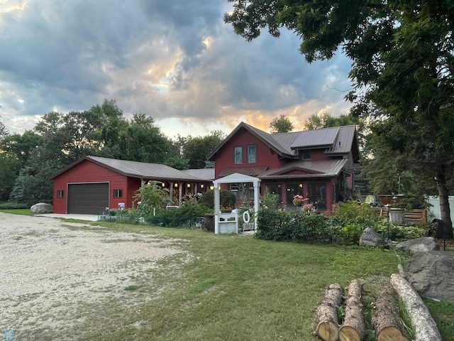 8416 141st Ave SE, Milnor, ND 58060 - view of front of house featuring dirt driveway, a garage, a front lawn, and metal roof