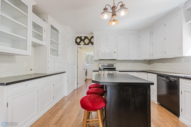 8416 141st Ave SE, Milnor, ND 58060 - kitchen with white microwave, dishwasher, electric stove, dark countertops, and tasteful backsplash