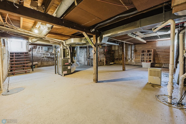 8416 141st Ave SE, Milnor, ND 58060 - unfinished basement featuring heating unit and stairway