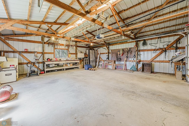 8416 141st Ave SE, Milnor, ND 58060 - garage with metal wall, a workshop area, and a garage door opener