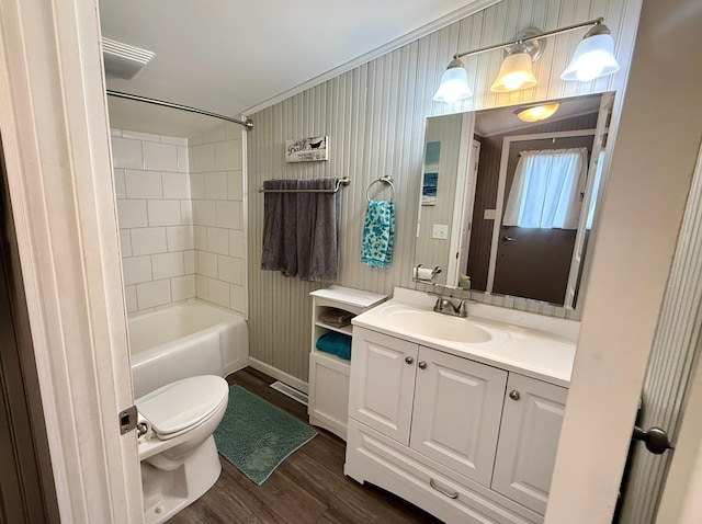 4231 Teal Ln NE, Bemidji, MN 56601 - full bathroom with toilet, wood finished floors, vanity, tub / shower combination, and crown molding