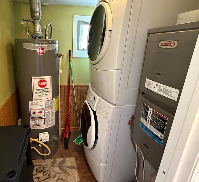 4231 Teal Ln NE, Bemidji, MN 56601 - laundry area with gas water heater, stacked washing machine and dryer, and a wainscoted wall