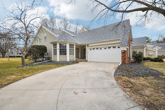 4311 Pond View Dr, White Bear Twp, MN 55110 - traditional-style home with a garage, driveway, a shingled roof, and a front yard