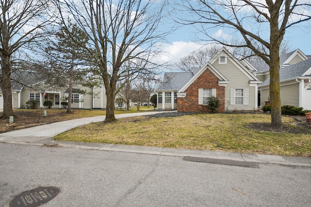4311 Pond View Dr, White Bear Twp, MN 55110 - view of front of home featuring brick siding and a front yard