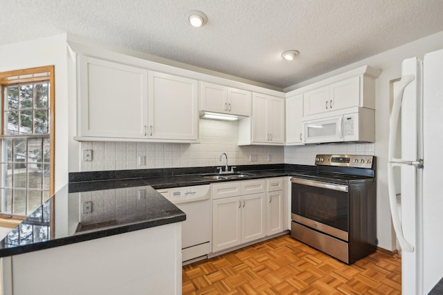 4311 Pond View Dr, White Bear Twp, MN 55110 - kitchen featuring white appliances, a sink, white cabinetry, a peninsula, and a textured ceiling