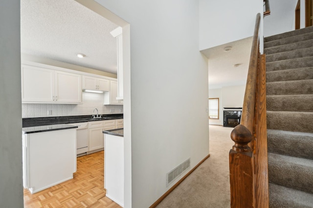 4311 Pond View Dr, White Bear Twp, MN 55110 - stairs with a glass covered fireplace