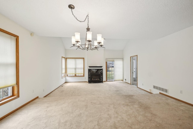 4311 Pond View Dr, White Bear Twp, MN 55110 - unfurnished living room featuring a chandelier, carpet flooring, baseboards, a fireplace, and vaulted ceiling