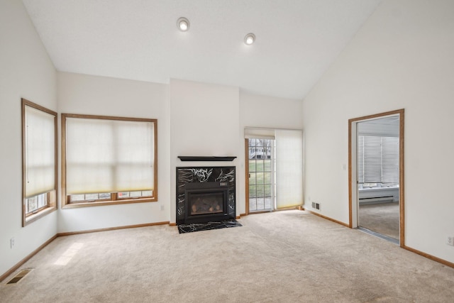 4311 Pond View Dr, White Bear Twp, MN 55110 - unfurnished living room with carpet, baseboards, a high end fireplace, high vaulted ceiling, and a baseboard heating unit