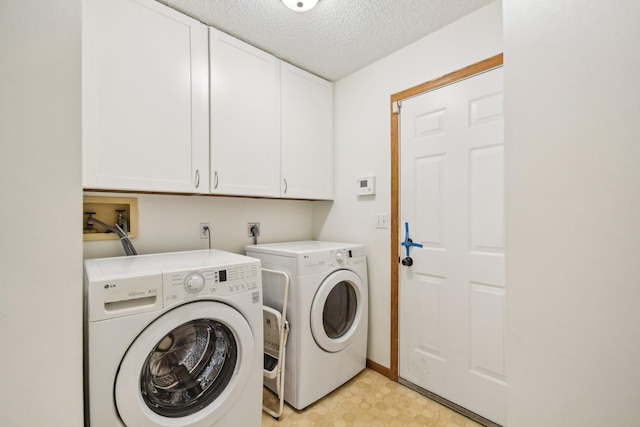 4311 Pond View Dr, White Bear Twp, MN 55110 - laundry area with cabinet space, separate washer and dryer, light floors, a textured ceiling, and baseboards