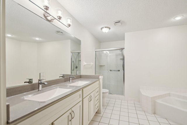4311 Pond View Dr, White Bear Twp, MN 55110 - full bathroom featuring tile patterned floors, a shower stall, a textured ceiling, double vanity, and a garden tub