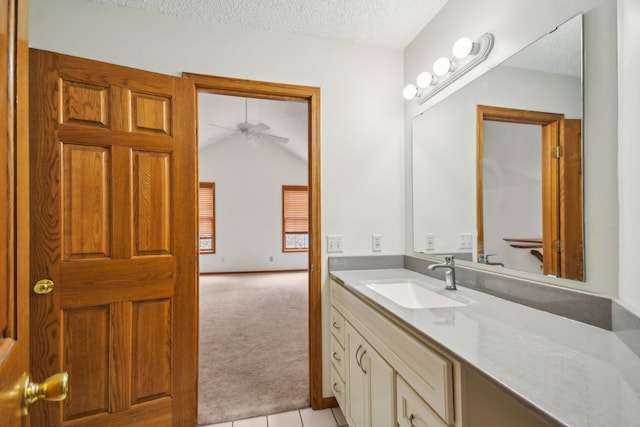 4311 Pond View Dr, White Bear Twp, MN 55110 - bathroom featuring a textured ceiling, a ceiling fan, vanity, and tile patterned flooring