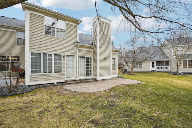 4311 Pond View Dr, White Bear Twp, MN 55110 - rear view of property featuring a chimney, a patio area, and a lawn
