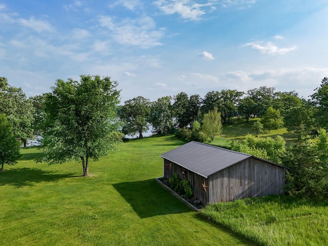 29506 435th Ave, Ottertail, MN 56571 - view of green lawn featuring a pole building and an outbuilding