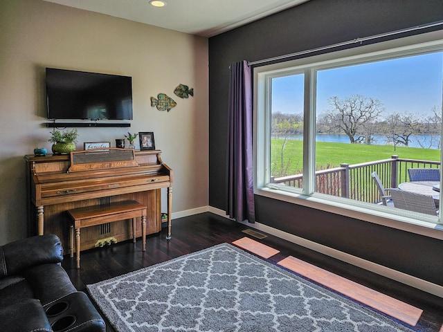 29506 435th Ave, Ottertail, MN 56571 - living area with a water view, baseboards, dark wood finished floors, and recessed lighting