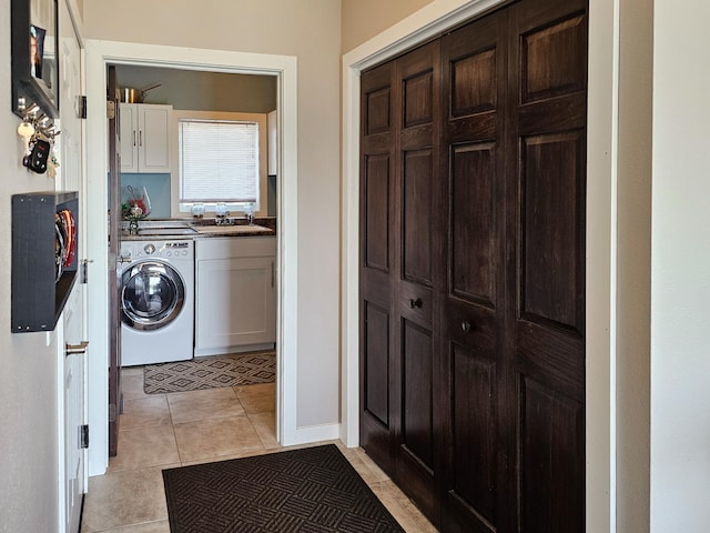 29506 435th Ave, Ottertail, MN 56571 - laundry area with washer / clothes dryer, cabinet space, and light tile patterned floors