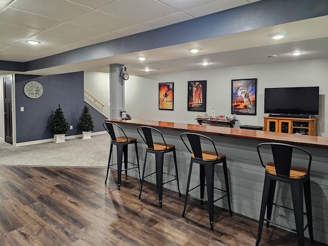 29506 435th Ave, Ottertail, MN 56571 - bar featuring a drop ceiling, stairs, baseboards, dark wood-style floors, and recessed lighting