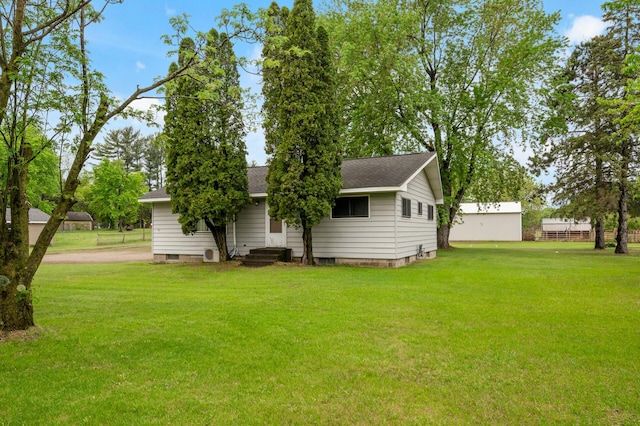 28748 Palm St NW, Isanti, MN 55040 - rear view of property featuring a yard and a shingled roof