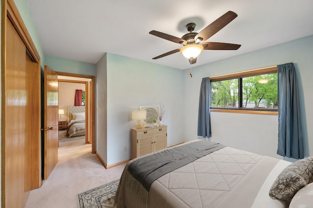 28748 Palm St NW, Isanti, MN 55040 - bedroom featuring light carpet, ceiling fan, baseboards, and a closet