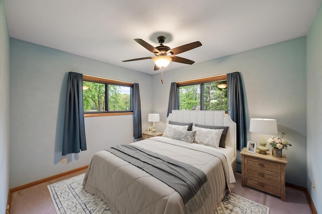 28748 Palm St NW, Isanti, MN 55040 - bedroom featuring baseboards, light colored carpet, and ceiling fan