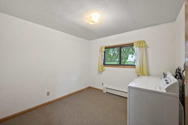 28748 Palm St NW, Isanti, MN 55040 - laundry area featuring baseboard heating, a textured ceiling, washing machine and dryer, carpet, and baseboards