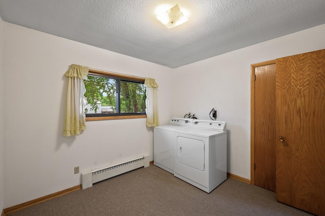 28748 Palm St NW, Isanti, MN 55040 - laundry area with a baseboard radiator, washer and dryer, carpet floors, a textured ceiling, and baseboards