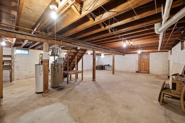 28748 Palm St NW, Isanti, MN 55040 - below grade area featuring gas water heater, stairs, and water heater