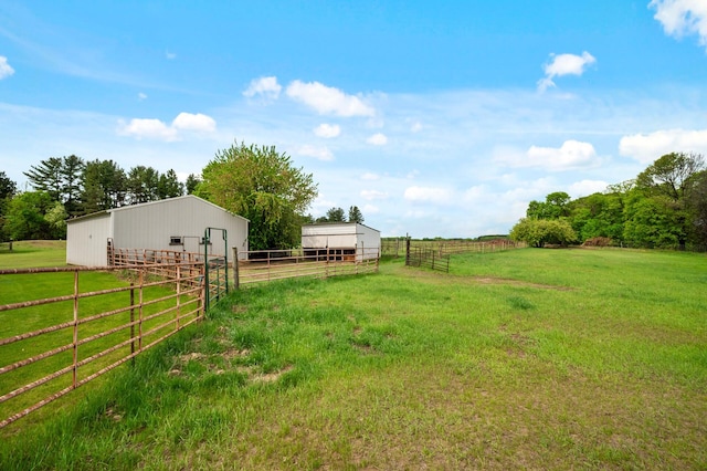28748 Palm St NW, Isanti, MN 55040 - view of yard with an outbuilding, an exterior structure, an outdoor structure, and a view of countryside