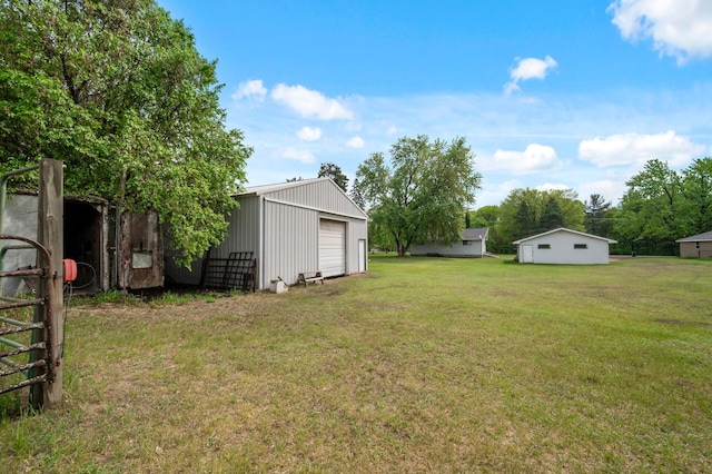 28748 Palm St NW, Isanti, MN 55040 - view of grassy yard with a garage and an outdoor structure