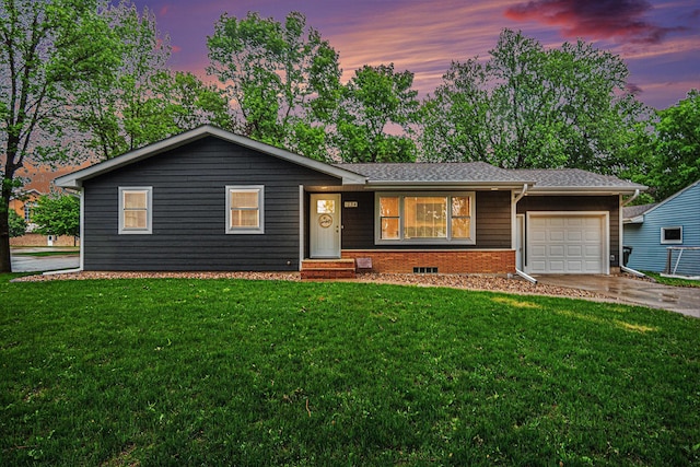 1034 Elmwood Ave, Luverne, MN 56156 - ranch-style house with an attached garage, concrete driveway, and a yard