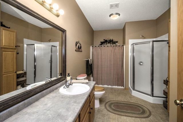 15229 Cobalt St NW, Ramsey, MN 55303 - bathroom featuring a stall shower, tile patterned floors, vanity, toilet, and a textured ceiling